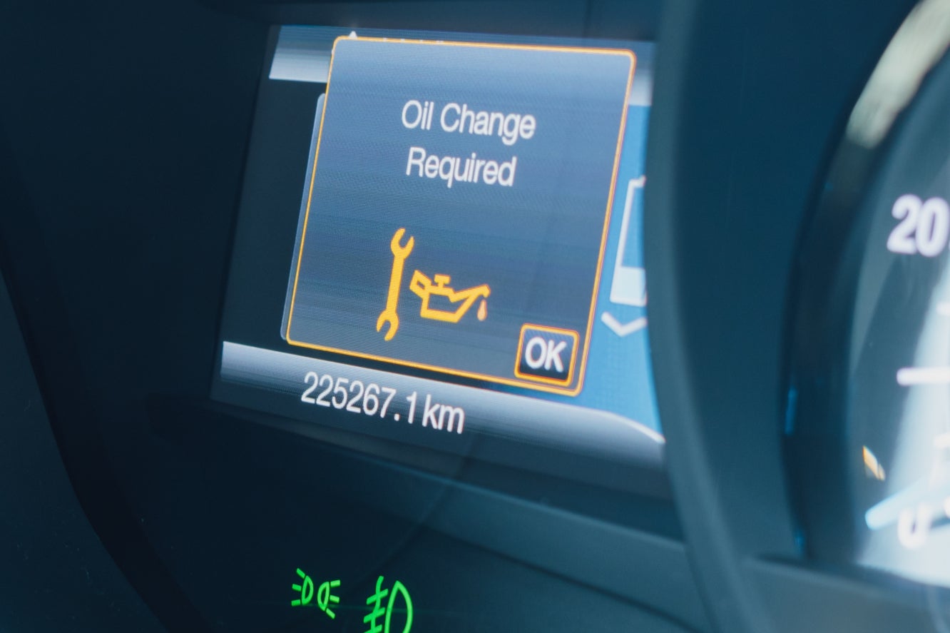 An oil change light appearing on a vehicle's dashboard.